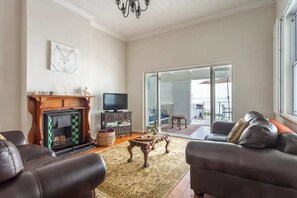 TV, fireplace - Character & Comfort | Spacious Home w/ Ocean Views (Cape Town)