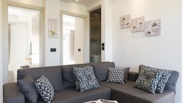 Deluxe Apartment | Living area | 45-inch LCD TV with cable channels