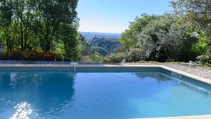 A swimming pool with a clear view of the surrounding landscape.