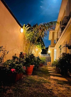 Stunning residential building with a beautifully maintained garden and balcony.