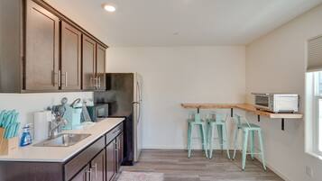 Microwave, high chair, cookware/dishes/utensils, spices