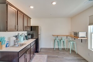 Microwave, high chair, cookware/dishes/utensils, spices