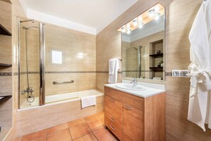 Bathtub, hair dryer, towels