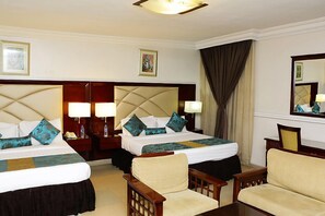 Habitación familiar | Ropa de cama de alta calidad y edredones de plumas