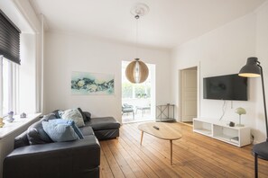 Apartment (2) | Living area | 52-inch flat-screen TV with digital channels, streaming services