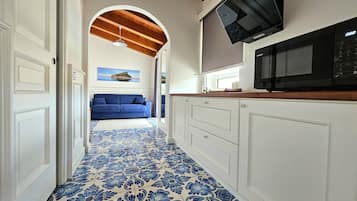 Family Quadruple Room | Free minibar, in-room safe, individually decorated