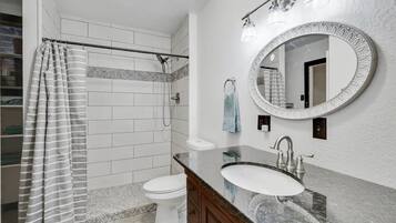 Shower, eco-friendly toiletries, hair dryer, towels