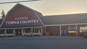 A building with a sign reading "KIDRON TOWN & COUNTRY".