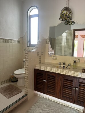 Shower, hair dryer, towels, soap