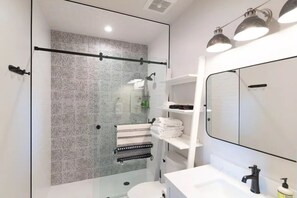 Shower, hair dryer, towels, soap - Historic Main Street Lofts - 3rd floor (Gunnison)