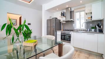 Premier Apartment | Private kitchen | Full-size fridge, stovetop, coffee/tea maker, highchair