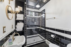 Shower, hair dryer, towels, soap
