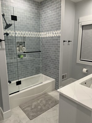Shower, hair dryer, towels, soap