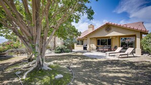 A house with a patio, outdoor seating, and a large tree. - Resort Perks, Patio & Gas Grill: Indio Retreat! (Indio)