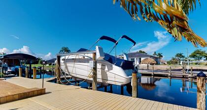 Canal-front home with private heated pool, dock, river views, patio, grill & W/D