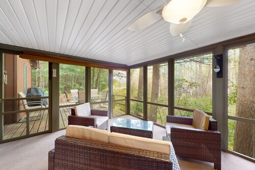 Lakefront cabin with kayaks, firepit, dock & spacious interior