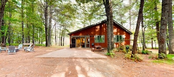 Lakefront cabin with kayaks, firepit, dock & spacious interior