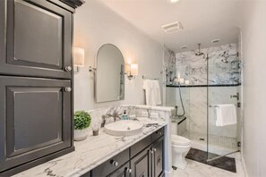 Shower, hair dryer, towels, soap