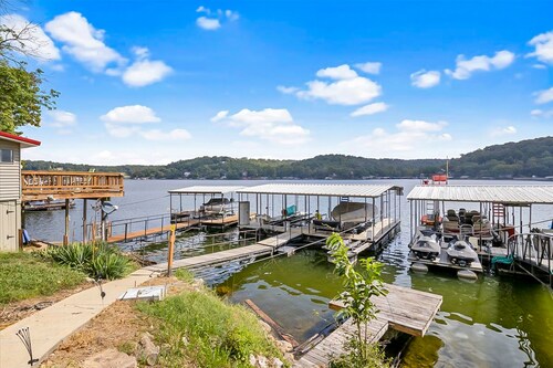 Secluded lakefront home with dock, fire table, lake views, & streaming