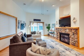 TV, fireplace, books