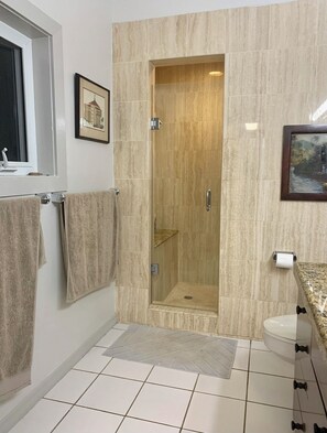 Shower, hair dryer, towels, toilet paper