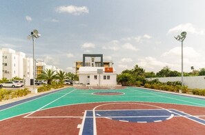 Guests can enjoy a game of basketball on the outdoor court adjacent to the building.
