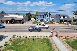 Main Street with a blue building, a white building, and a Red Poppy building.