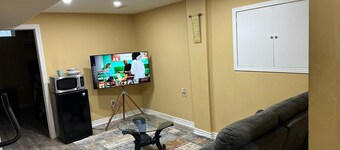 1 bedroom basement suite with spacious living room and laundry, no kitchen.