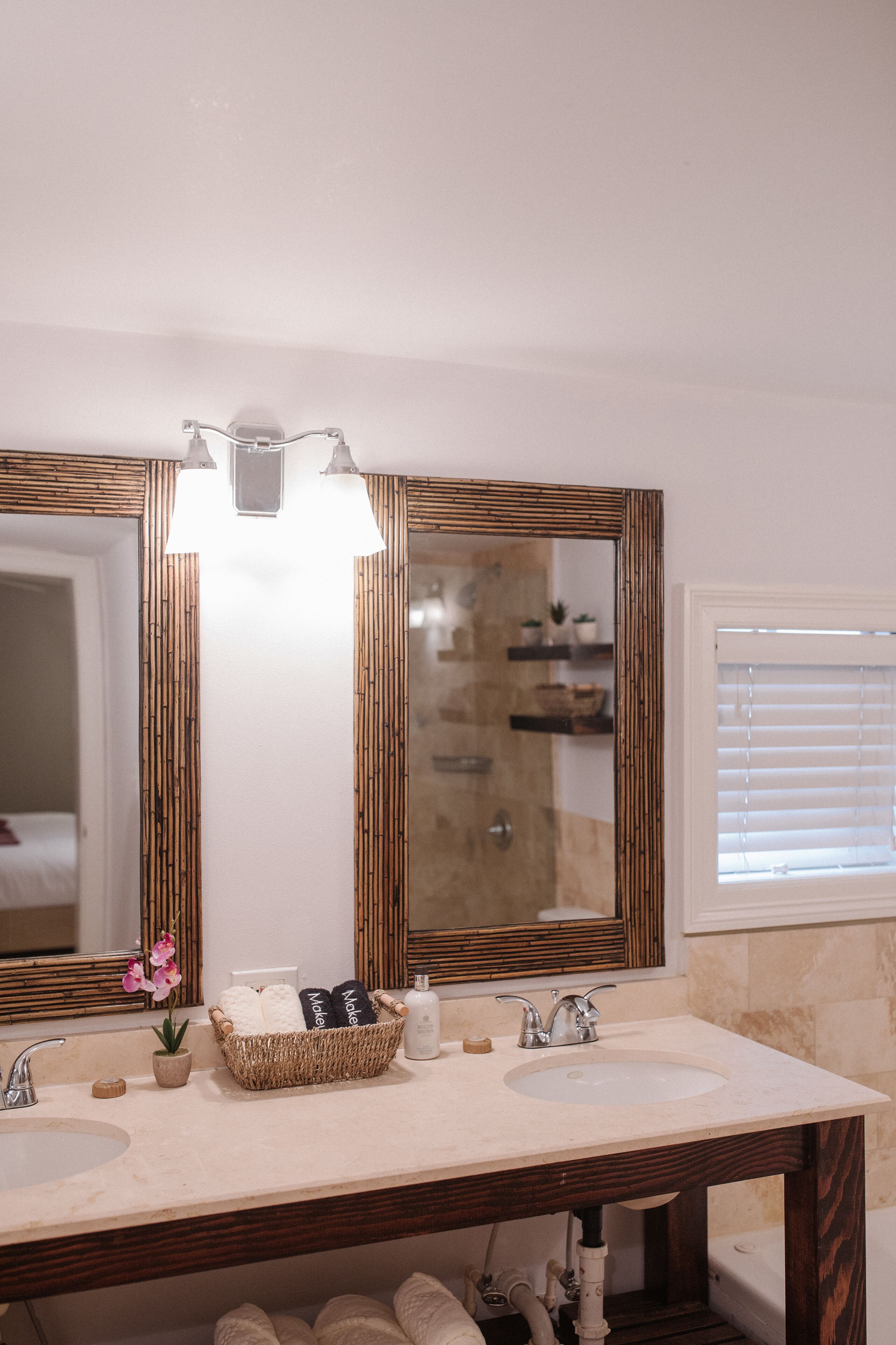 deluxe suite | bathroom | hair dryer, bathrobes, slippers, towels