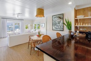 Luxury Cottage | Living area | 65-inch Smart TV with cable channels, books - The Rock House Hotel (Dunmore Town)