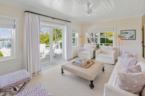 Luxury Cottage | Living area | 65-inch Smart TV with cable channels, books