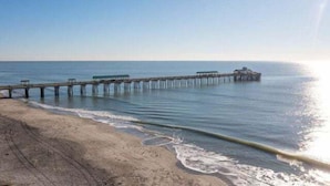 A pier extending into calm waters with a clear sky. - Folliday Inn - The Coronado - Room 11 (Folly Beach)