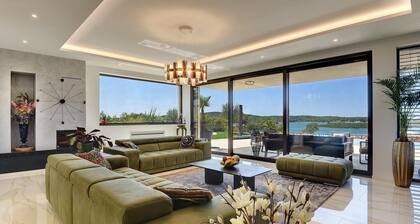 Luxury villa La Casaccia with a heated pool near Medulin with a stunning sea view.