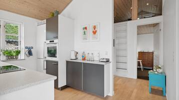 Fridge, stovetop, dishwasher, coffee/tea maker