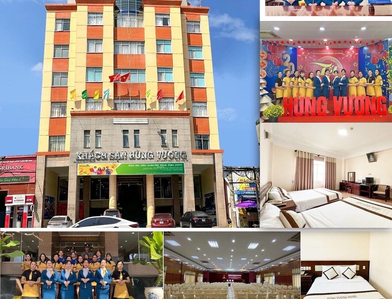 A multi-story hotel building with a sign reading "KHACH SAH HUNG VUONG".