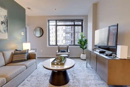 TV, offices. Sojourn | Courtland Towers | 1 BR w/Bocci Ball Court