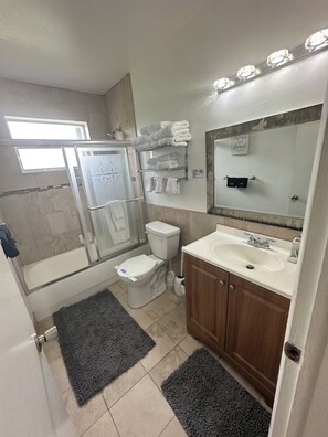 Shower, hair dryer, towels, soap