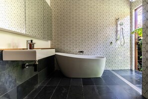 Bathtub, hair dryer, towels