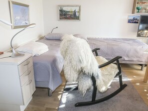 A bedroom with a bed, a chair, a desk, and a lamp. - Siularinne b9 by Interhome (Inari)