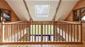 A wooden interior with a skylight, stone staircase, and a view of the outdoors. - La Favrais by Interhome (Saint aubin de terregatte)