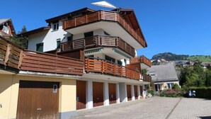 A multi-story building with balconies and a covered walkway. - Penthouse Brugg by Interhome (Amden)
