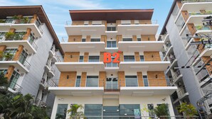 A multi-story building with balconies and a sign indicating 'B2'. - B2 Suan Luang Rama 9 Srinakarin 42 Boutique & Budget Hotel (Bangkok)