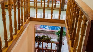 A wooden staircase with a handrail leading to an upper level. - Room-hb3 Double Room With Private Bathro (Cartagena)