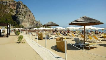 Private beach, white sand, sun loungers, beach umbrellas