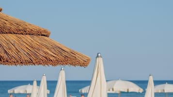 Private beach, white sand, sun-loungers, beach umbrellas