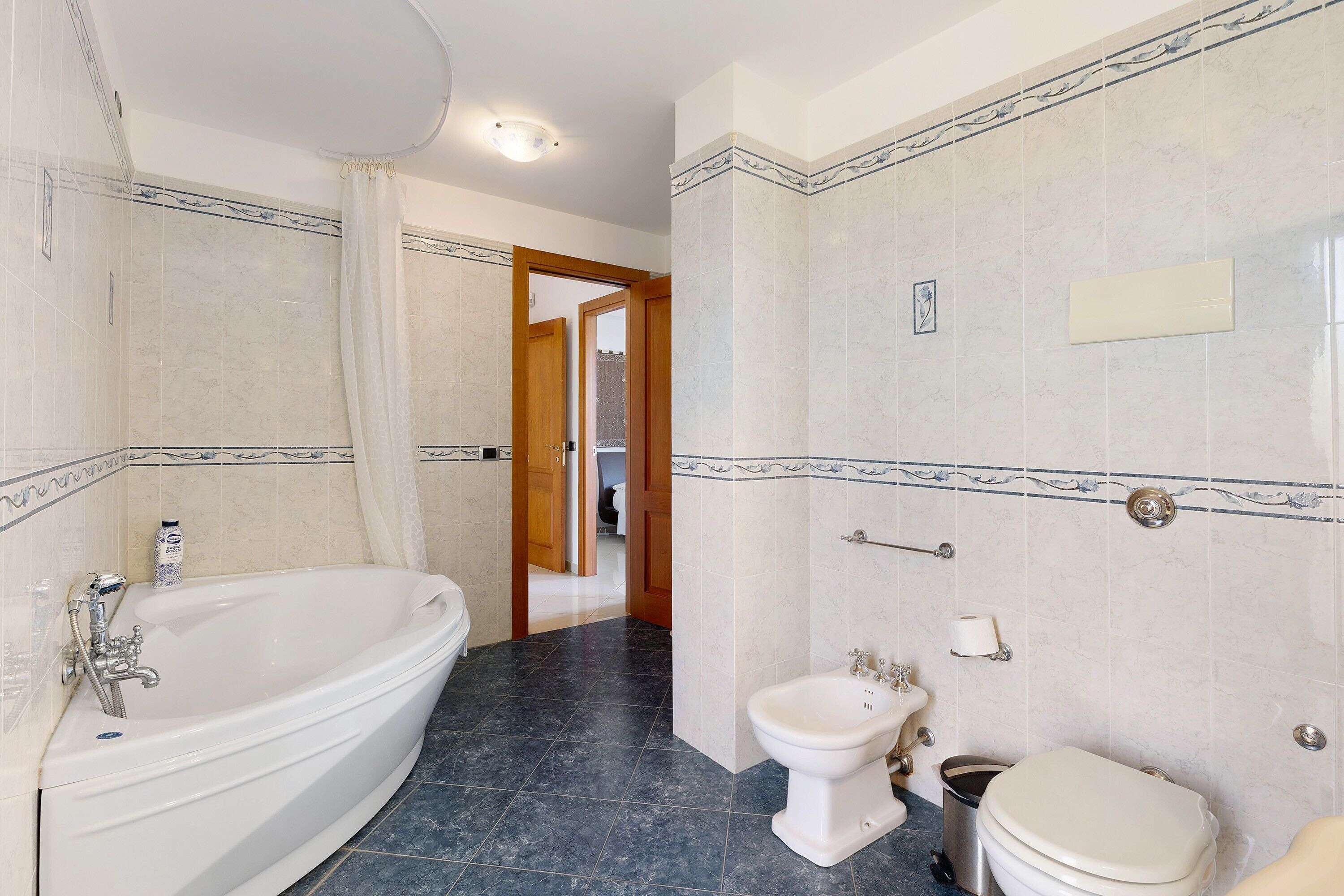 Bathtub, hair dryer, towels