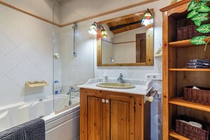 Bathtub, hair dryer, towels