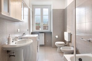 Bathtub, hair dryer, towels