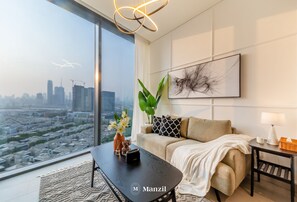 Living area - Manzil - Sleek 1BR nr Downtown w Burj views (Dubai)