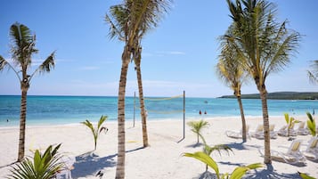 On the beach, white sand, sun loungers